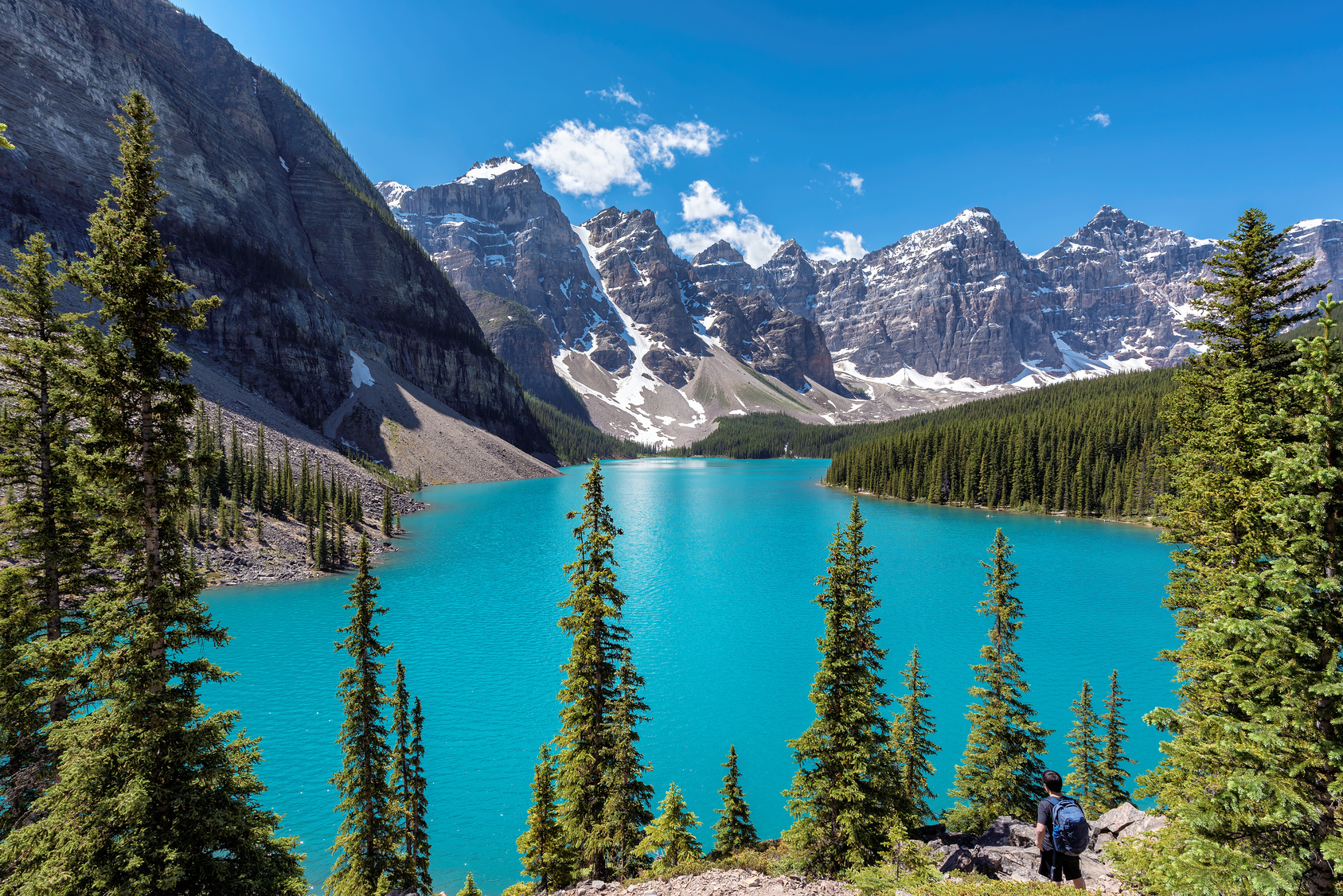 Banff National Park, Canada. Moraine Lake with snow-covered peaks above it in Rocky Mountains.