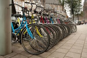 bigstock-Bikes-parked-in-the-city-Amste-25892963